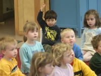 Samuel Habib, 3, sits in his supportive corner chair and raises his hand during circle time.    Dan Habib photo