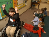 Samuel celebrates getting an answer right at school at Shaker Road School pre-kindergarten.  Dan Habib photo