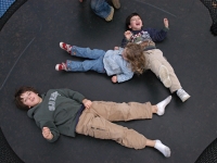 Samuel plays on a trampoline with his brother Isaiah and cousin Natalie Kogan Habib.   Dan Habib photo