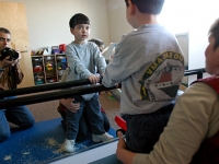 Samuel does physical therapy with Colleen Sullivan at Pediatric Physical Therapy on Thursday, 2/24/05.  His father, photographer Dan Habib, is reflected in mirror.  Dan Habib photo