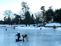 Samuel skates on his Bronco walker at White Park pond with Isaiah.  Dan Habib photo