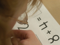 Academic supports, like a laptop, headphones and word prompts, are critical to Alana's success in regular classes.   Dan Habib photo