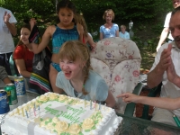 Alana Malfy blows out the candles on her birthday cake. Dan Habib photo