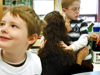 Marlene Orellana comforts her son, Nathaniel, a first-grader at Haggerty who has autism. Before they came to Haggerty, the district said Nathaniel should be placed in a separate classroom for children with disabilities. But Marlene and her husband insisted Nathaniel be integrated into a typical classroom.   Dan Habib photo