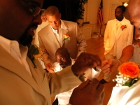 Keith Jones, center, is surrounded by groomsmen just before the wedding ceremony. Jones married Kerlyne Pacombe at the Milton Hoosic Club in Milton, Massachusetts.