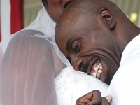 Keith P. Jones and Kerlyne Pacombe embrace on their wedding day.  (Dan Habib/Concord Monitor)